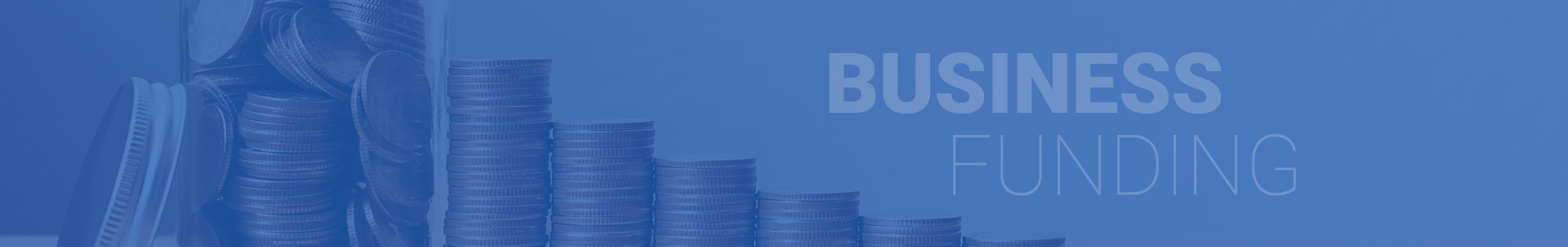 A blue background with stacks of coins and the word business.